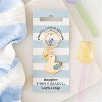 Keychain charm packaging with a seagull design on a striped background
