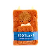 Fluffy orange Highland Cow notebook with a blue strap labeled 'Scotland' on a white background
