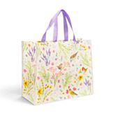 Floral-patterned gift bag with a purple handle on a white background