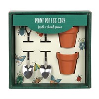 Set of plant pot egg cups with shovel spoons in packaging