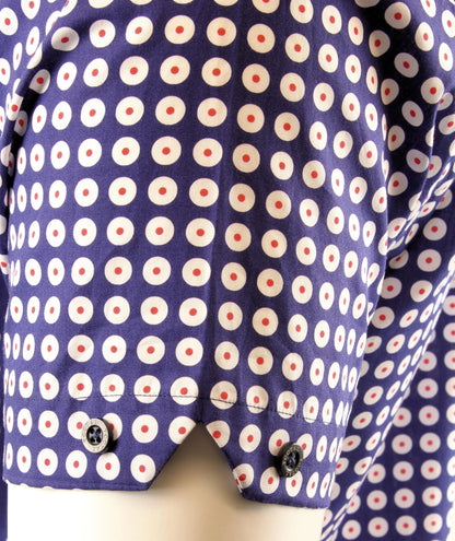 Close-up of a shirt with a target pattern on a mannequin.